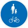 Blå skylt med vita siluetter av gångtrafikant och cykel